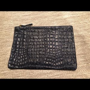 Claire V. Navy blue alligator embossed clutch.